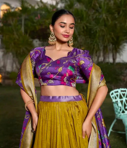 Mustard Color Kalamkari Printed With Zari Weaving Border Dola Silk Lehenga Choli